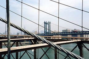 Photograph of the Manhattan Bridge through the Brooklyn Bridge by wallyg on Flickr